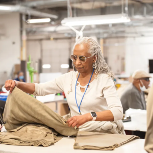 Someone folding fabric