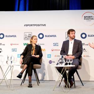 four people seated on a stage