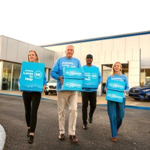 people walking with boxes