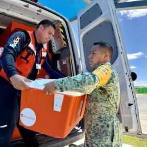 Loading supplies into a FedEx vehicle