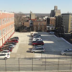 Cars parked between buildings