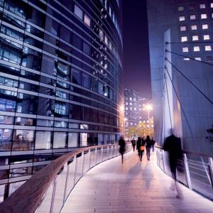 People walking in city at night