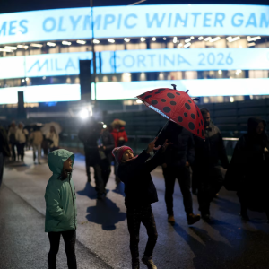 Pedestrians walking outside Olympic stadium