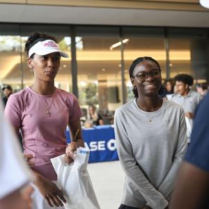 Small group of smiling people talking together.