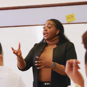 someone teaching at whiteboard