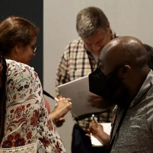 a group of four people working in pairs