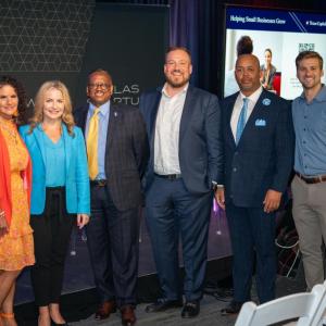 Six people posed in a line