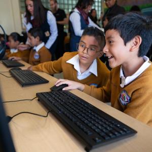 Children working together on laptops