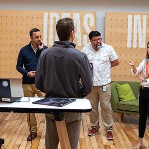 team standing in a room