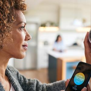 Person programming thermostat