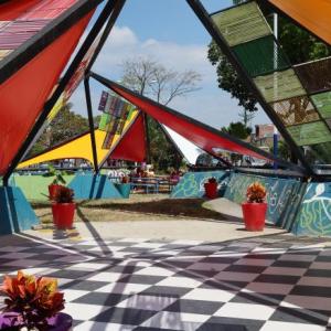 checkered flooring and triangular colorful fabric roof pieces