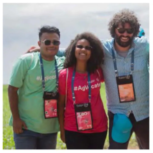 Three people with matching lanyards