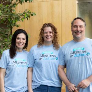 Three volunteers posed in matching tshirts.