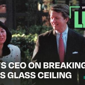 Text: "Aflac's CEO on breaking Japan's Glass Ceiling". Two people walking and talking together outside