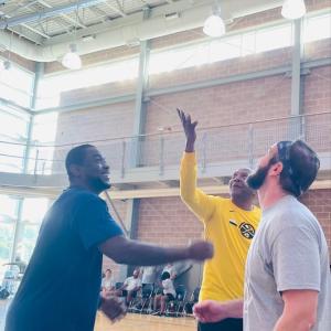 NBA legend Alex English tips off to Aflac Employee Team member, Quan Prowell (left) and Aflac Leaders Team member, Cary Allen (right).