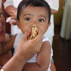 woman feeding baby food
