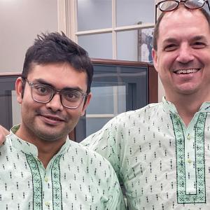 Two employees wearing traditional clothing from Bangladesh