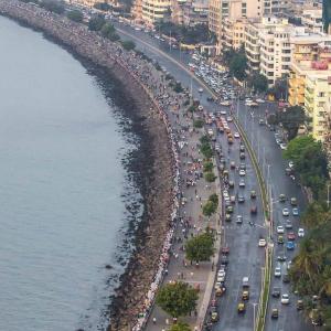 Aerial view of busy traffic and pedestrians along a coast