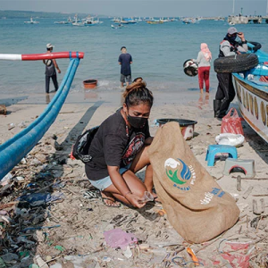 People cleaning up a beach
