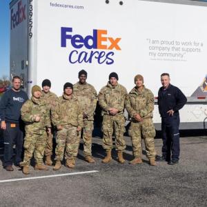 Group photo in front of FedEx Cares truck