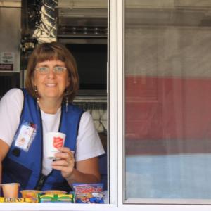 Debbie Clarke in the side service window of the CRU truck