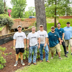 Six volunteers standing outside