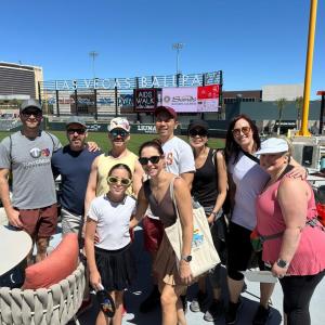 A team posed at a baseball event.