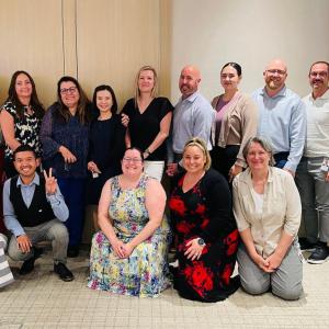 A group posed inside.