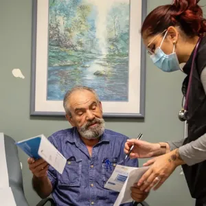 Health staff at Venice Family Clinic work with a patient. The health center was one of 15 recipients in the latest round of funding supporting health services in the aftermath of Los Angeles-area wildfires. (Photo courtesy of Venice Family Clinic/Barbara Grover)