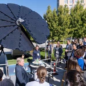 People stood looking at the SmartFlower Solar