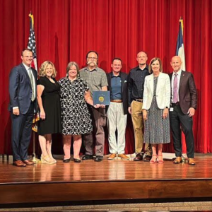 People standing on a stage together