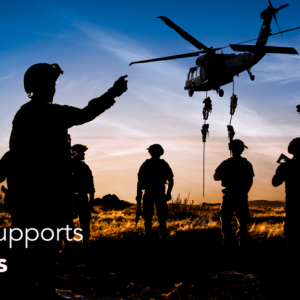 "Leidos Supports Veterans" over an image of silhouetted soldiers on the ground as some descend from a helicopter.