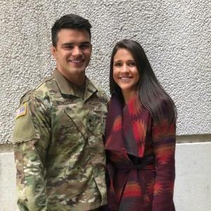 Morgan and Logan Mcintosh standing together smiling. Morgan in military uniform.