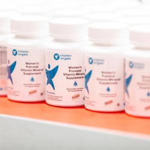 Bottles labeled "Women's prenatal vitamins"