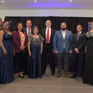 A group posed in formal attire