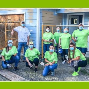 Volunteers outside a home