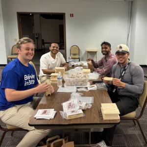 Volunteers pack bags at a table