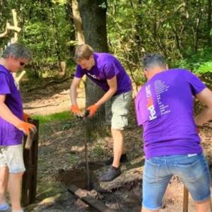 Volunteers doing landscaping work at a park.