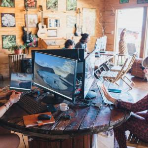 Work for Humankind volunteers working at computers