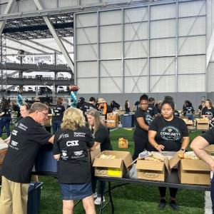 Volunteers sorting items in boxes