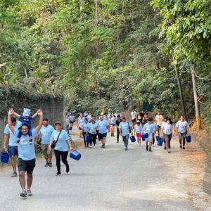 Participants walking the Walk for Water event up hill