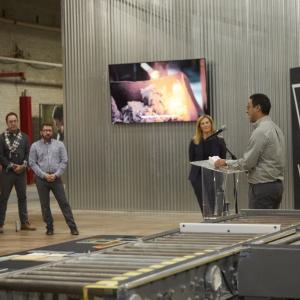 Matthew Sanchez speaking to others "Waste Lab Kohler" behind them.