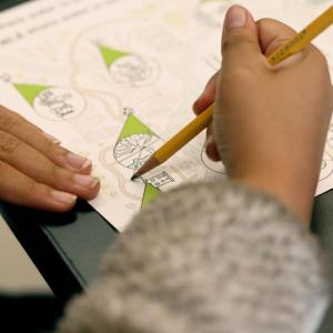 Child drawing on a piece of paper