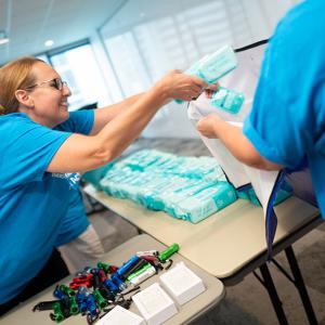 Duke Energy employee volunteer packing wet wipes 