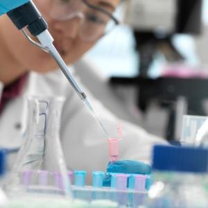 Illumina scientist shown working with samples.