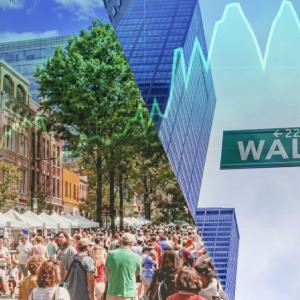 people walking down Wall St.