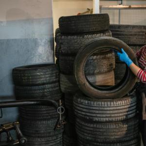 Person stacking tires