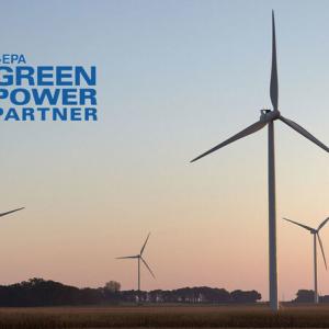 wind turbines at sunset, with Green Power partner logo