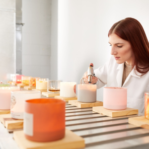 Employee burn testing candles to ensure exceptional safety and performance.