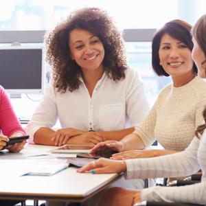 women sitting around an office table